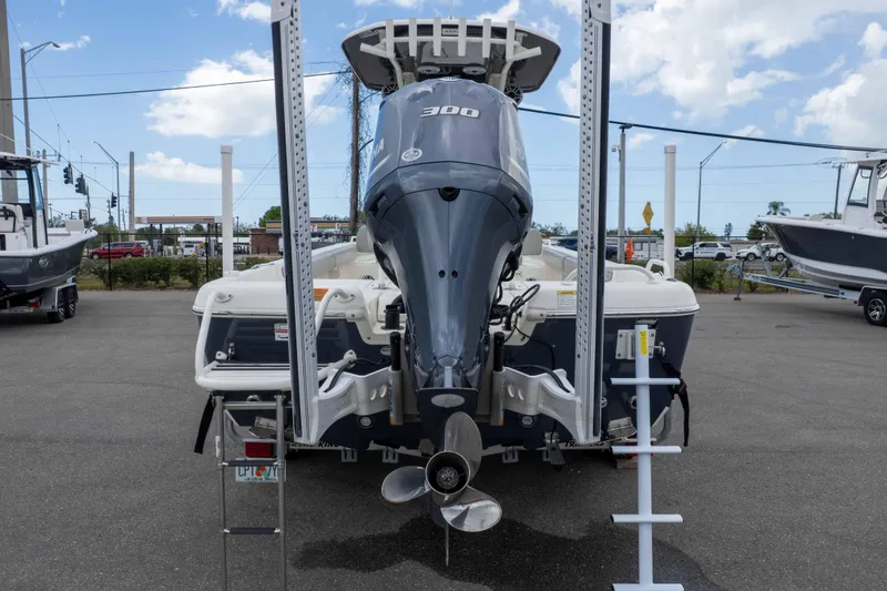 Slide: The Image of 2021 Skeeter SX2550 Family boat with powerful outboard motor, parked outdoors. - 45
