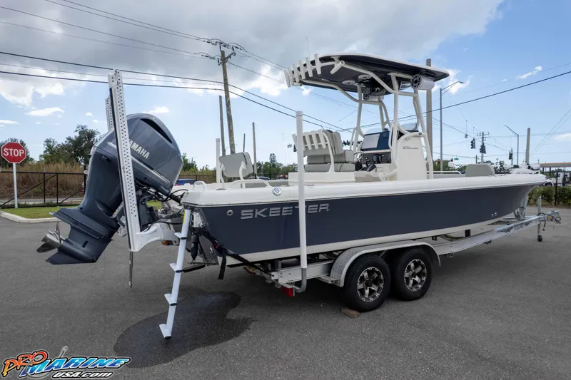 Slide: The Image of 2021 Skeeter SX2550 Family boat on trailer with Yamaha outboard motor. - 48