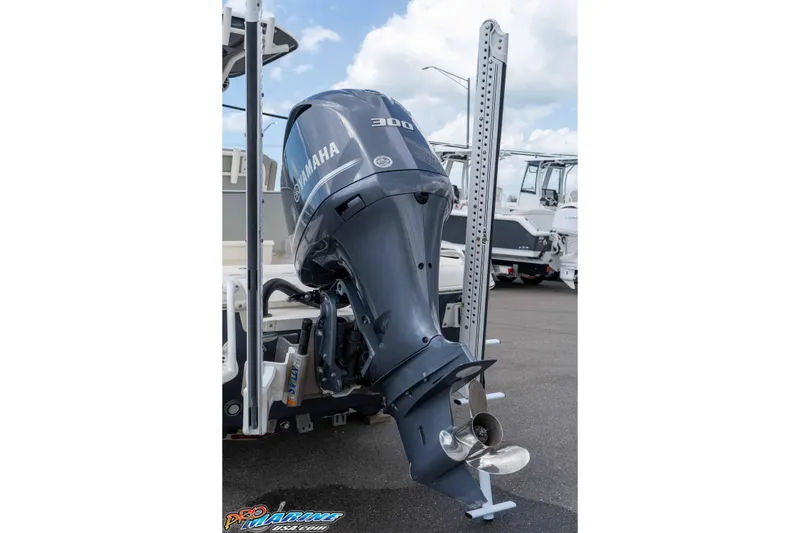 Slide: The Image of 2021 Skeeter SX2550 Family boat with Yamaha 300 outboard motor in a marina. - 5