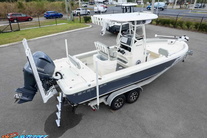 Slide: The Image of 2021 Skeeter SX2550 Family boat on trailer, featuring Yamaha outboard motor. - 50