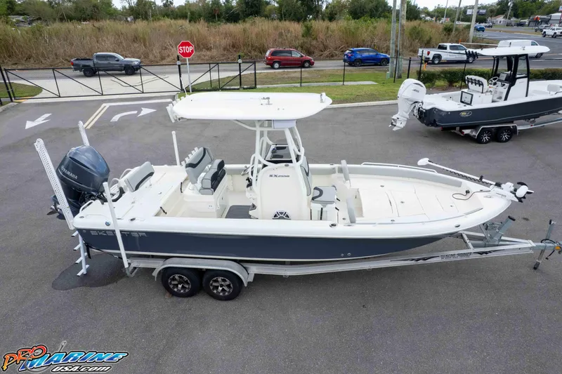 Slide: The Image of 2021 Skeeter SX2550 Family boat on trailer in parking lot, aerial view. - 52