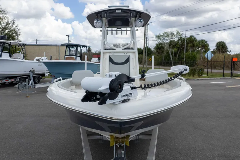 Slide: The Image of 2021 Skeeter SX2550 Family boat with Minn Kota trolling motor, parked outdoors. - 56