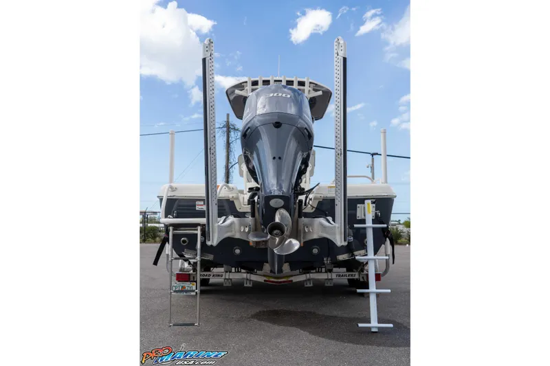 Slide: The Image of 2021 Skeeter SX2550 Family boat rear view with outboard motor and ladder. - 6