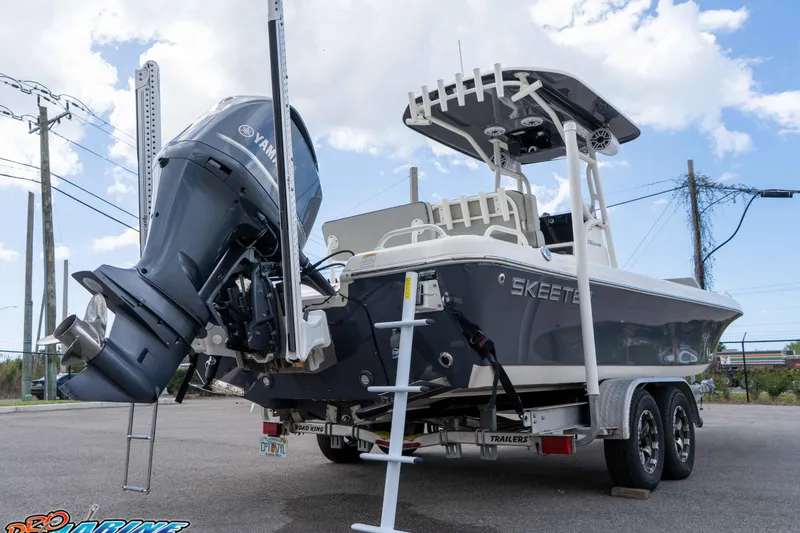 Slide: The Image of 2021 Skeeter SX2550 Family boat with Yamaha engine on trailer, parked outdoors. - 7