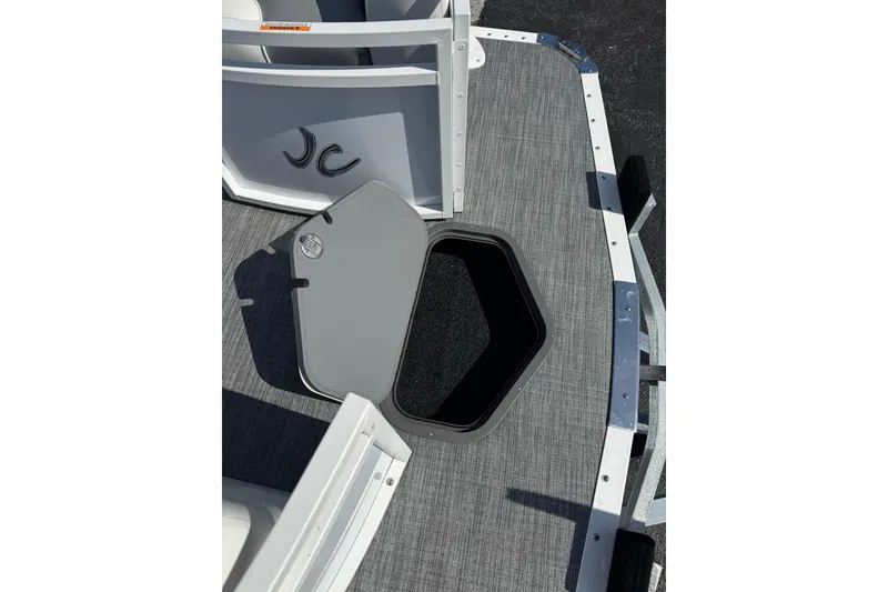 Slide: The Image of Open storage compartment on 2026 JC Spirit 222 TT Sport boat deck. - 6