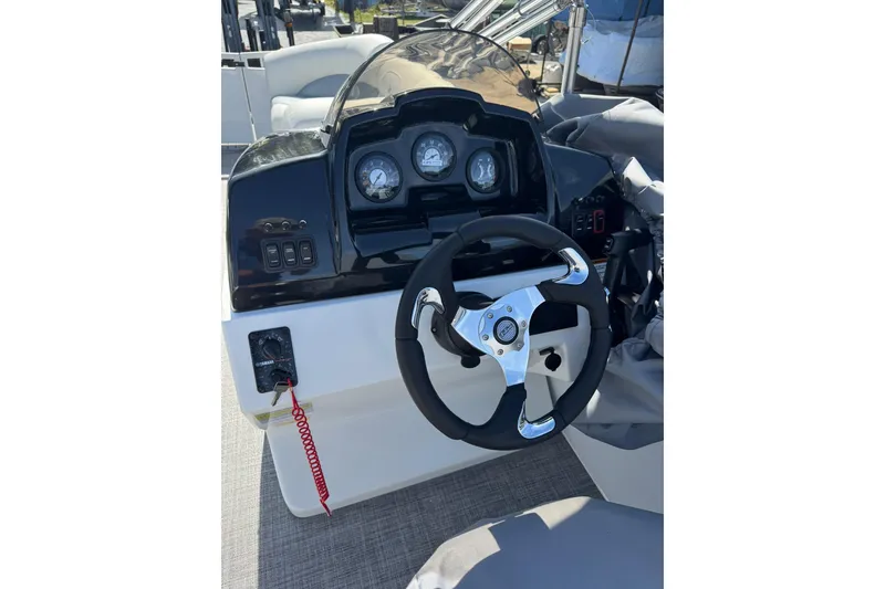 Slide: The Image of Steering console of 2026 JC Spirit 222 TT Sport boat with gauges and controls. - 8