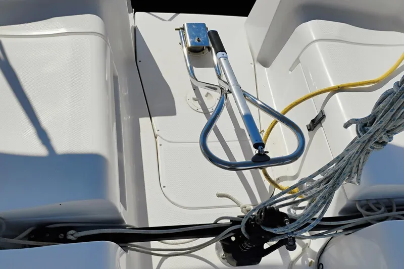 Slide: The Image of Cockpit of 2006 Hunter 27 sailboat with ropes and steering mechanism. - 10