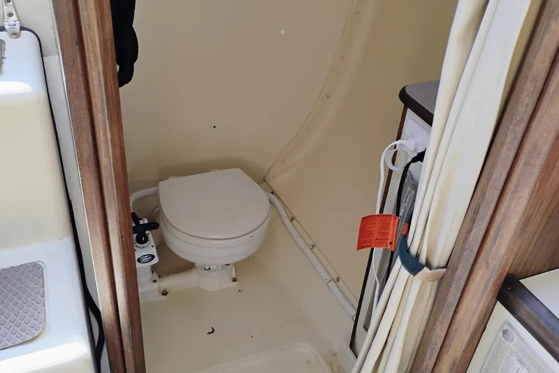 Slide: The Image of Compact marine toilet in 2006 Hunter 27 sailboat bathroom. - 14