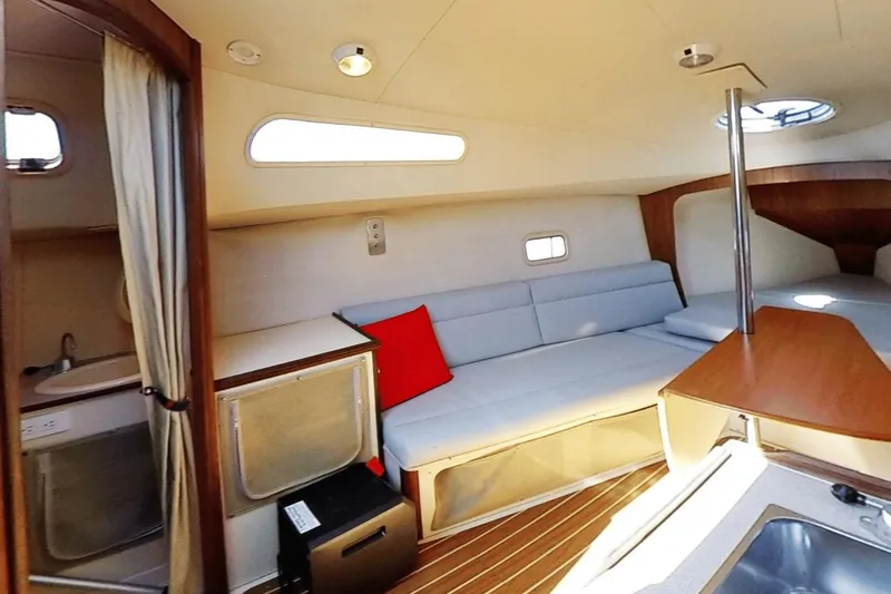 Slide: The Image of Interior of 2006 Hunter 27 sailboat with cozy seating and modern amenities. - 15