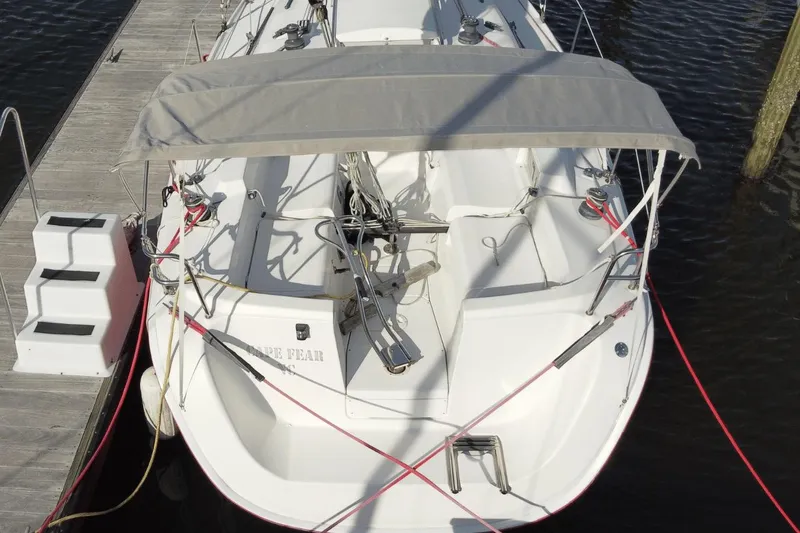 Slide: The Image of Hunter 27 sailboat, 2006 model, docked with canopy and red ropes, viewed from above. - 7