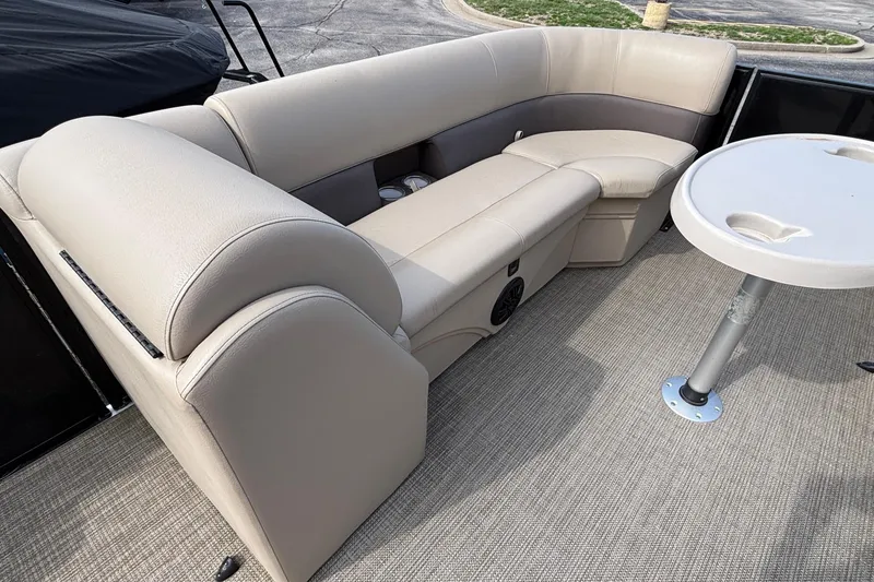 Slide: The Image of Luxurious seating area on 2023 Bentley 243 Navigator boat with beige upholstery and table. - 10