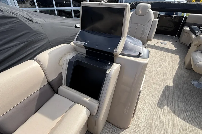 Slide: The Image of 2023 Bentley 243 Navigator interior with beige seating and console. - 14