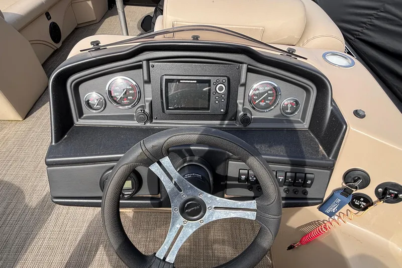 Slide: The Image of Dashboard of 2023 Bentley 243 Navigator boat with steering wheel and gauges. - 25