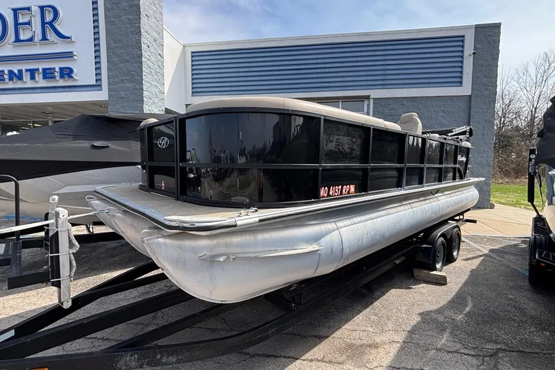 Slide: The Image of 2023 Bentley 243 Navigator pontoon boat on trailer at dealership. - 3
