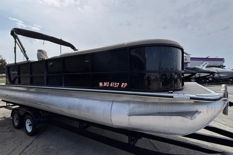 Slide: The Image of 2023 Bentley 243 Navigator pontoon boat on trailer, side view. - 31