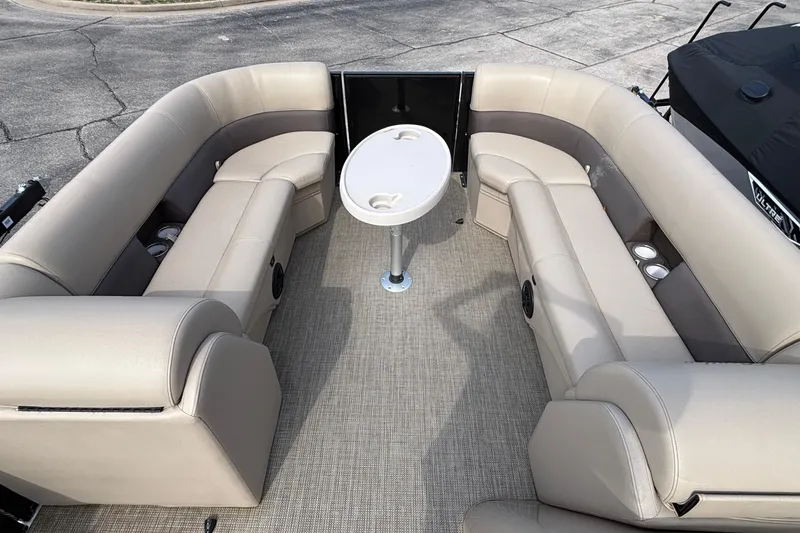 Slide: The Image of Luxurious interior of 2023 Bentley 243 Navigator pontoon boat with plush seating and table. - 9