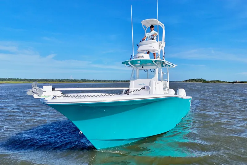 Slide: The Image of 2021 Onslow Bay 33 Tournament boat on water, clear blue sky background. - 12