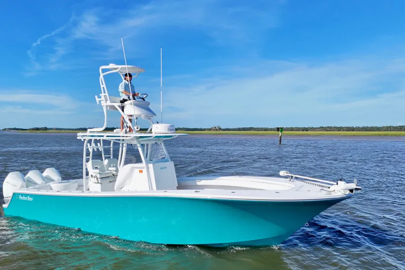 Slide: The Image of 2021 Onslow Bay 33 Tournament boat cruising on a sunny day with clear blue skies. - 19