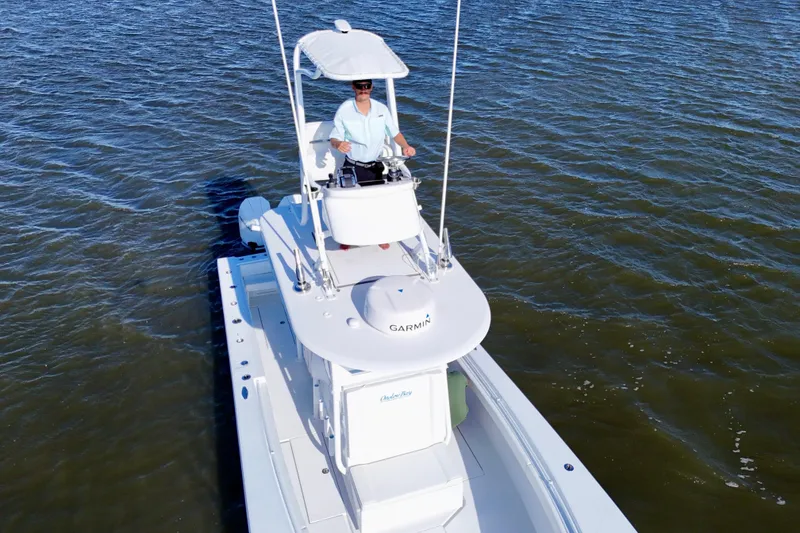 Slide: The Image of 2021 Onslow Bay 33 Tournament boat on water, featuring elevated helm station. - 23