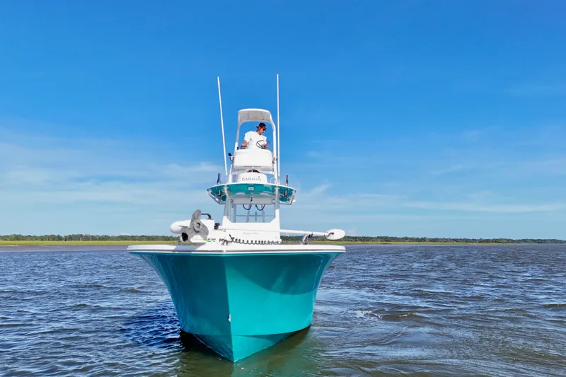 Slide: The Image of 2021 Onslow Bay 33 Tournament boat on open water under clear blue sky. - 32