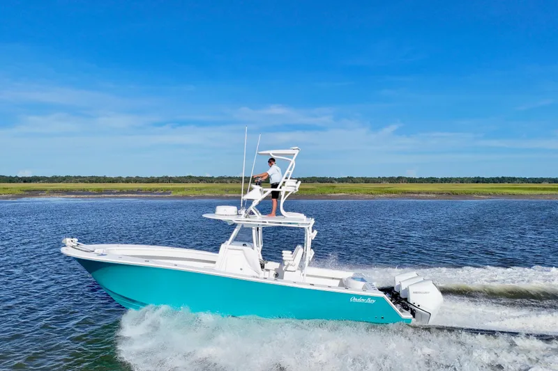 Slide: The Image of 2021 Onslow Bay 33 Tournament boat cruising on a sunny day. - 6