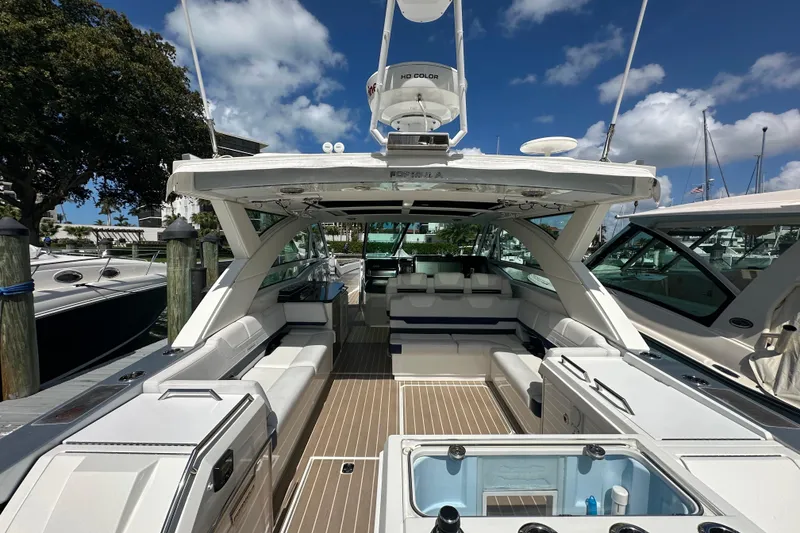 Slide: The Image of 2023 Formula 430 All Sport Crossover boat interior with luxurious seating and modern amenities. - 11