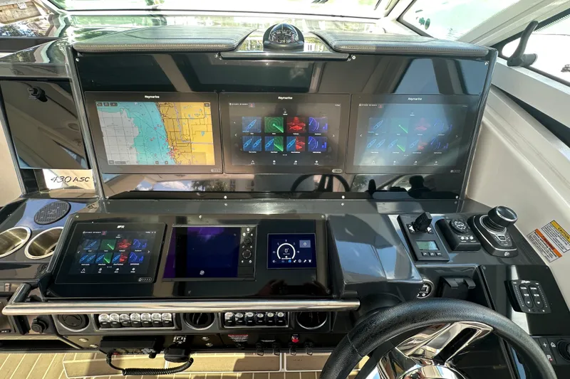 Slide: The Image of 2023 Formula 430 All Sport Crossover dashboard with advanced navigation displays. - 16