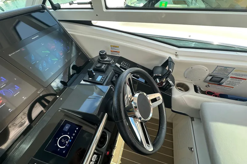 Slide: The Image of 2023 Formula 430 All Sport Crossover helm with advanced navigation displays and controls. - 17