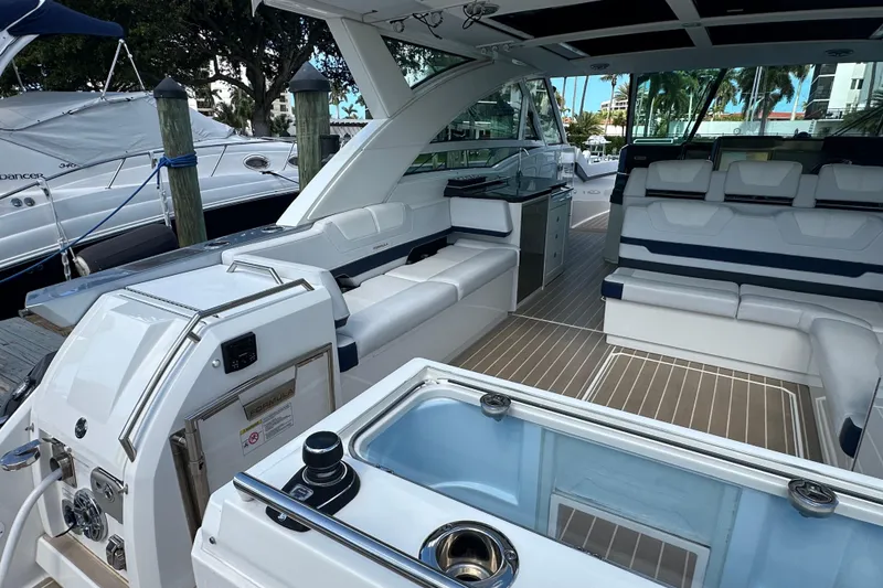 Slide: The Image of 2023 Formula 430 All Sport Crossover boat interior with luxurious seating and modern amenities. - 32