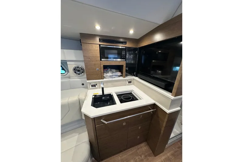 Slide: The Image of 2023 Formula 430 All Sport Crossover interior kitchen with modern appliances and sleek design. - 39