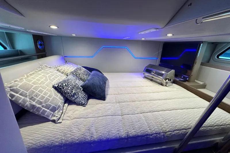 Slide: The Image of Luxurious interior of 2023 Formula 430 All Sport Crossover with modern bedding and ambient lighting. - 41