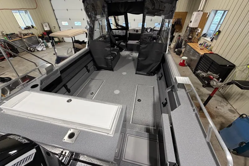 Slide: The Image of 2026 Lund 210 Heavy Gauge boat interior in a workshop setting. - 20