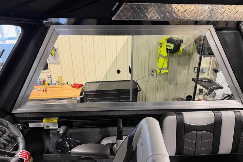 Slide: The Image of Interior of 2026 Lund 210 Heavy Gauge boat with modern seating and control panel. - 24