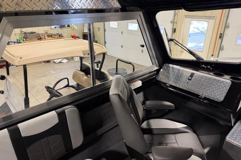 Slide: The Image of Interior of 2026 Lund 210 Heavy Gauge boat with modern seating and diamond plate accents. - 25