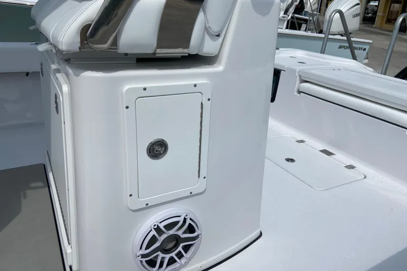 Slide: The Image of 2026 Sportsman Masters 267 Bay Boat console with speaker and storage compartment. - 19
