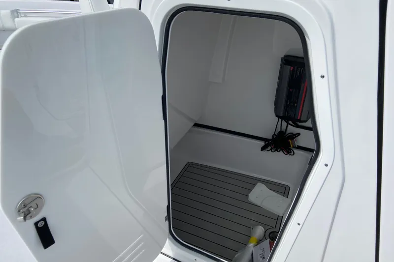 Slide: The Image of Open storage compartment in 2026 Sportsman Masters 267 Bay Boat, featuring clean interior design. - 31