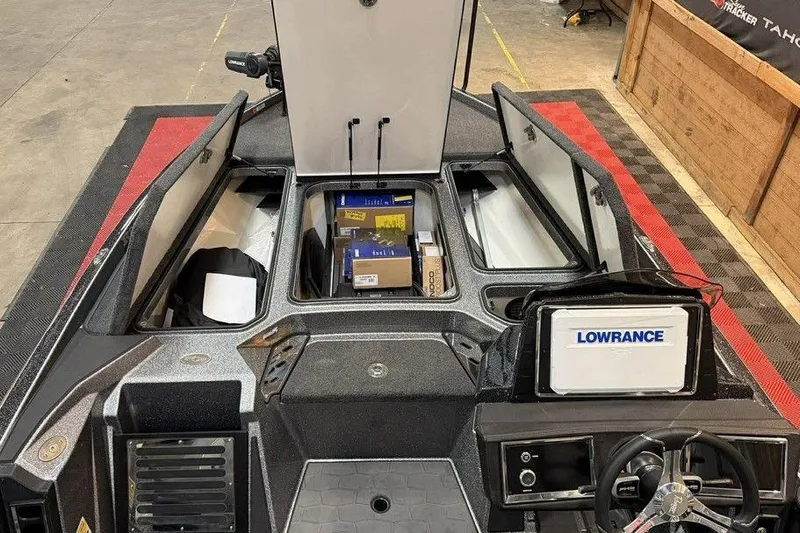 Slide: The Image of 2026 Ranger Z520R Cup-Equipped boat interior with storage compartments and Lowrance electronics. - 14