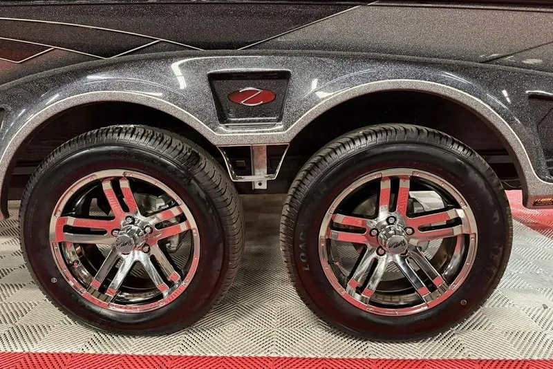 Slide: The Image of 2026 Ranger Z520R Cup-Equipped trailer with shiny chrome wheels and sleek design. - 15