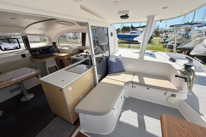 Slide: The Image of Luxurious 2014 Outremer 45 catamaran interior with modern seating and navigation area. - 12
