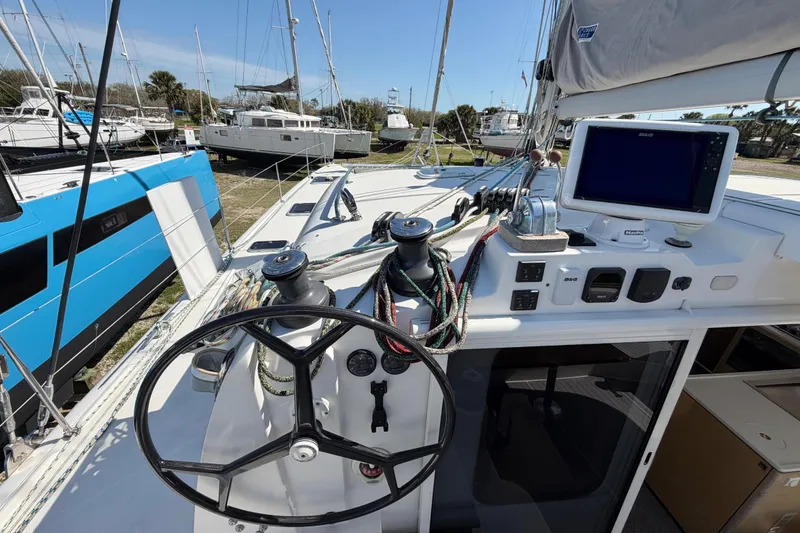 Slide: The Image of Cockpit of 2014 Outremer 45 catamaran with steering wheel and navigation equipment. - 15