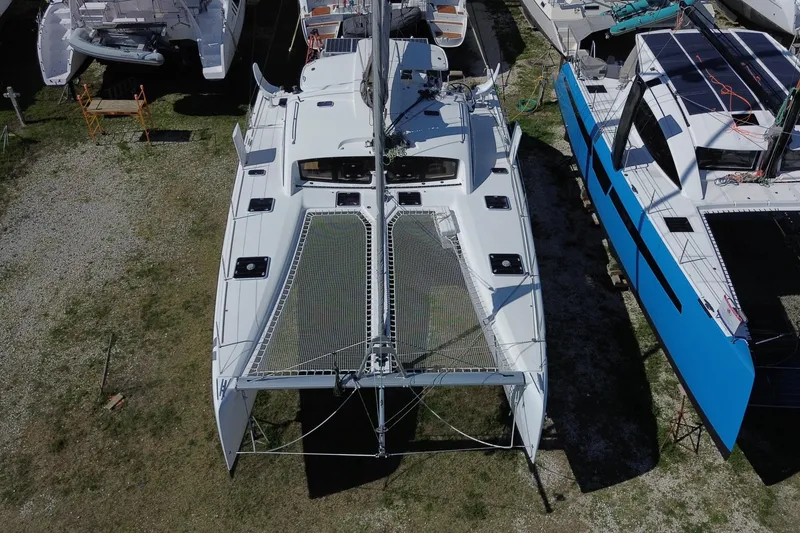 Slide: The Image of Aerial view of a 2014 Outremer 45 catamaran docked on land. - 3