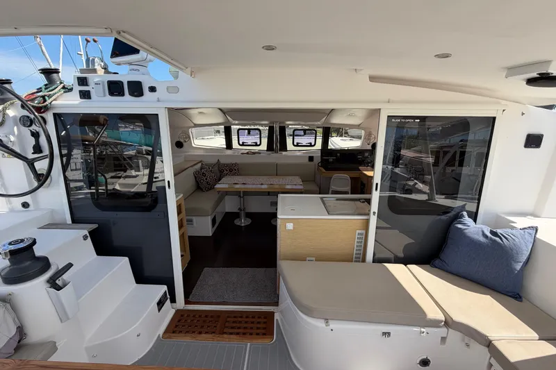 Slide: The Image of 2014 Outremer 45 catamaran interior with seating, navigation area, and helm station. - 30