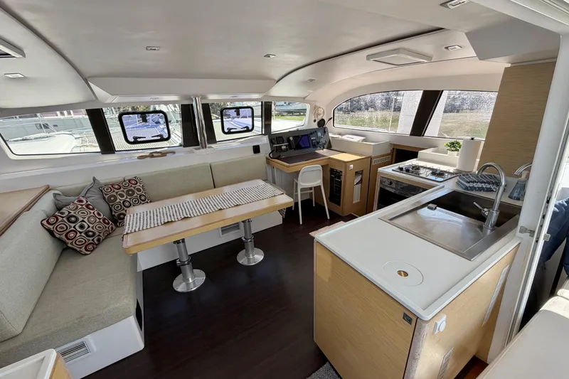 Slide: The Image of Interior of 2014 Outremer 45 catamaran with modern kitchen and seating area. - 31