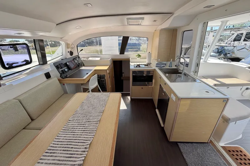 Slide: The Image of Interior of 2014 Outremer 45 catamaran featuring modern kitchen and seating area. - 32