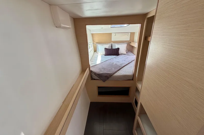 Slide: The Image of Interior of 2014 Outremer 45 yacht, featuring a cozy bedroom with modern design. - 43
