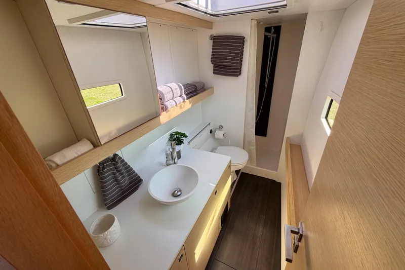 Slide: The Image of Luxurious bathroom in 2014 Outremer 45 yacht, featuring modern fixtures and ample storage. - 47