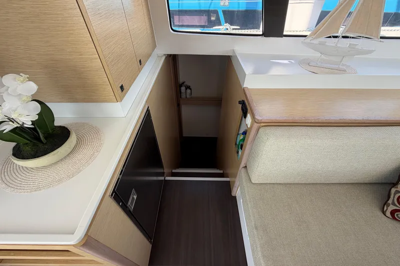 Slide: The Image of Interior of 2014 Outremer 45 yacht with modern decor and wooden cabinetry. - 52