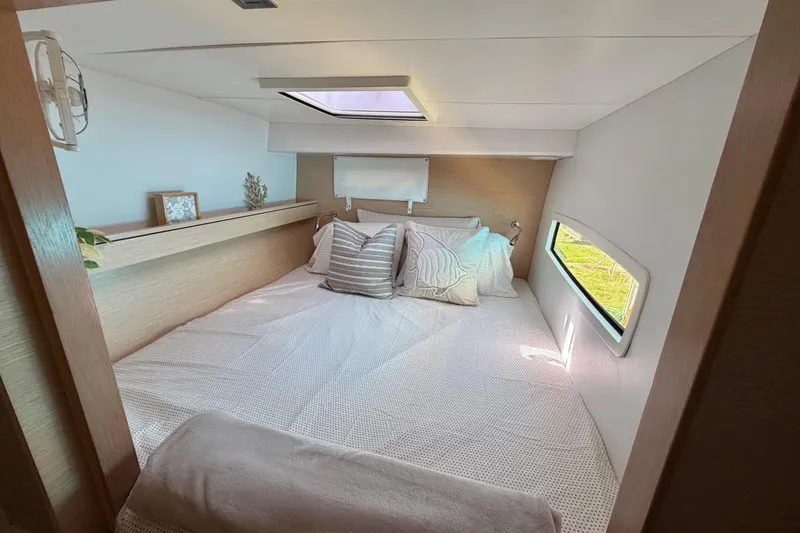 Slide: The Image of Cozy bedroom interior of 2014 Outremer 45 yacht with skylight and side window. - 55
