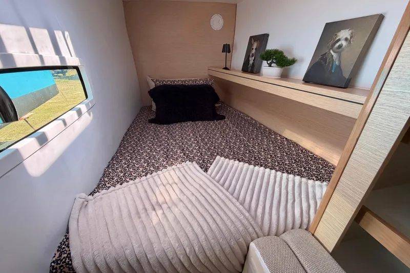 Slide: The Image of Cozy cabin interior of 2014 Outremer 45 with decorative pillows and artwork. - 62