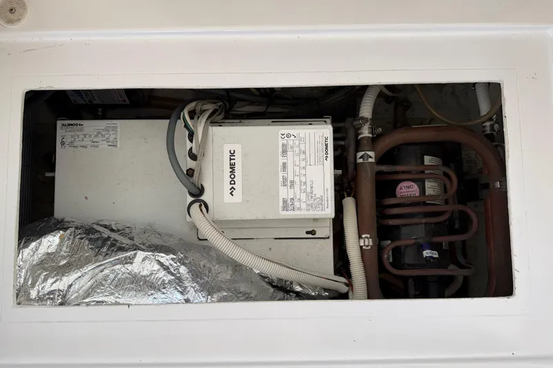 Slide: The Image of Dometic unit in 2014 Outremer 45 yacht, showcasing electrical and plumbing components. - 64